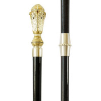 Staff of brass in gilding on wooden base Staff of brass in gilding on wooden base