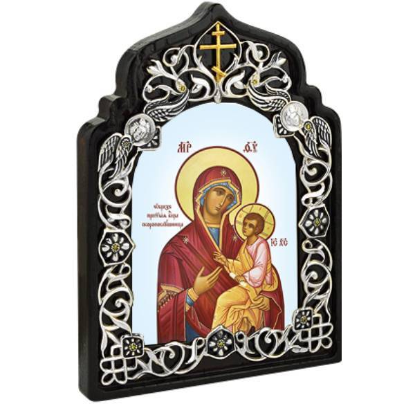 Tabletop icon made of silver-plated brass on a wooden base