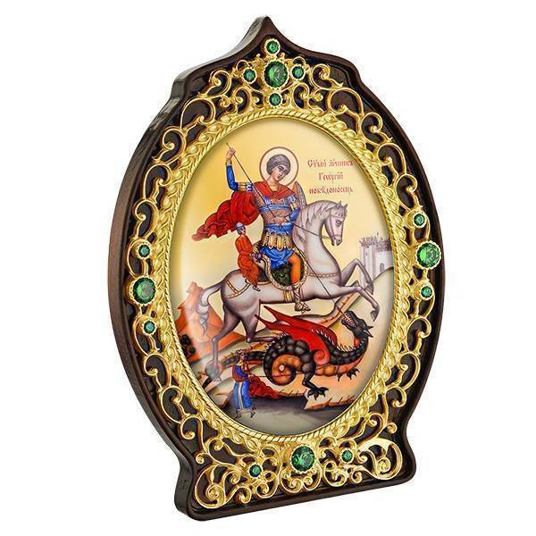 Brass icon of St. George the Victorious on wood in gilding Brass icon of St. George the Victorious on wood in gilding