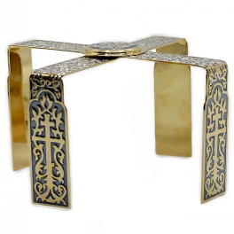 Brass asterisk with fragmentary gilding and oxidation
