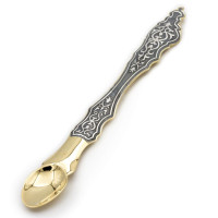 Ladle made of brass with a gilded and blackened finish