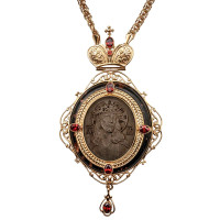 Brass engolpion panagia in gilding with a carved image on ebony Brass engolpion panagia in gilding with a carved image on ebony